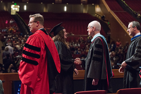 College of Agriculture and Life Sciences Convocation in the Byu-Idaho Center. Elder Wilson and President Clark along with College Dean, John Zenger congratulate the graduates.