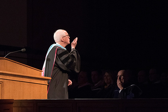 Elder Larry Y. Wilson blows a kiss to the BYU-Idaho Men's and Women's Choir at Commencement ceremony. Photo by Ryan Chase