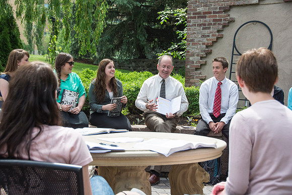 Brother Mark Orchard talks to students in his Interpersonal Theory and Practice class in the garden's during the 2014 Spring Semester.