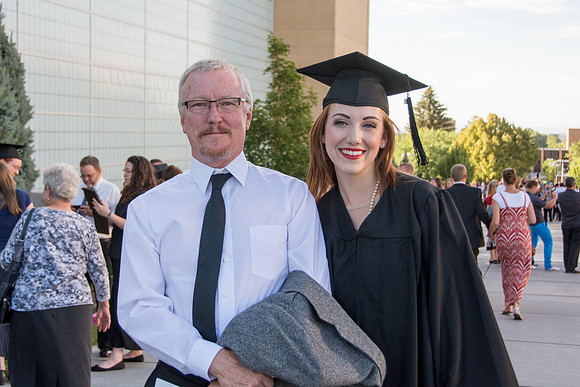 Faculty, family and graduates around campus after the commencement ceremony.