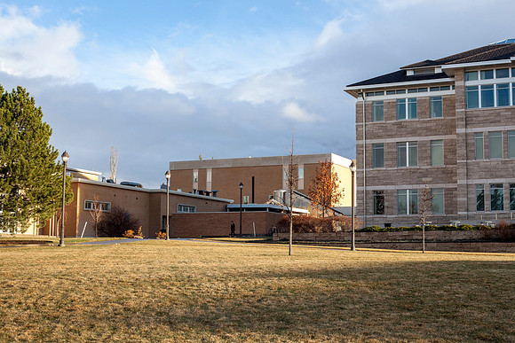 The Spori Building at sunset after a light rain on campus.