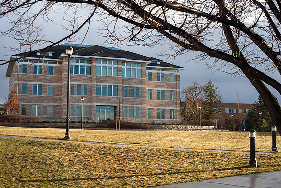 The Spori Building at sunset after a light rain on campus.