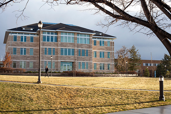 The Spori Building at sunset after a light rain on campus.