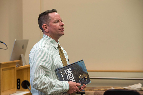 Wade Huntsman presents at the Performing and Visual Arts Colloquium.