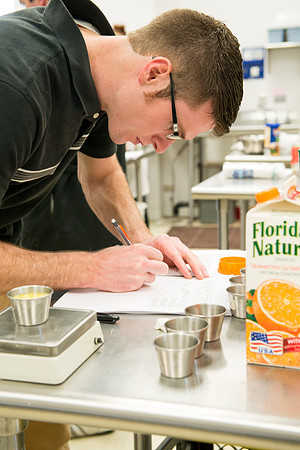 Students prepare food for taste testing in the Food Science Lab. This new major teaches students the science behind everyday foods. Instructors Neal Ricks and Kerry Huber.