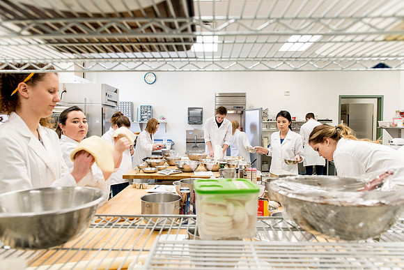 Students prepare food for taste testing in the Food Science Lab. This new major teaches students the science behind everyday foods. Instructors Neal Ricks and Kerry Huber.