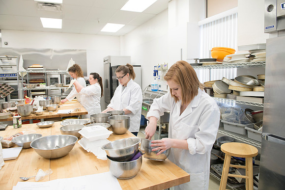 Students prepare food for taste testing in the Food Science Lab. This new major teaches students the science behind everyday foods. Instructors Neal Ricks and Kerry Huber.