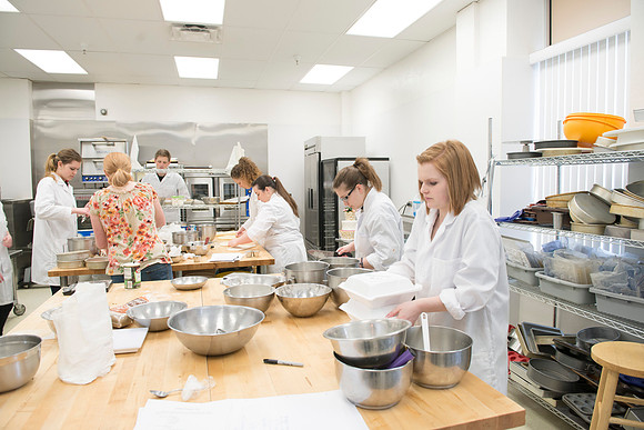 Students prepare food for taste testing in the Food Science Lab. This new major teaches students the science behind everyday foods. Instructors Neal Ricks and Kerry Huber.