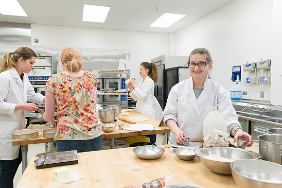 Students prepare food for taste testing in the Food Science Lab. This new major teaches students the science behind everyday foods. Instructors Neal Ricks and Kerry Huber.