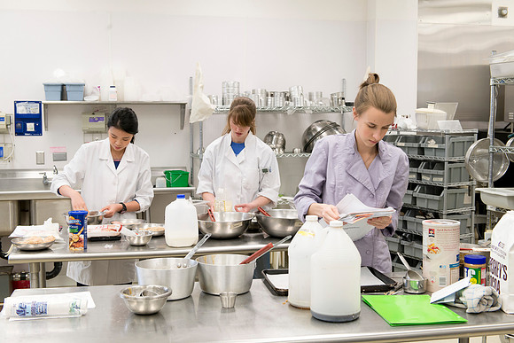 Students prepare food for taste testing in the Food Science Lab. This new major teaches students the science behind everyday foods. Instructors Neal Ricks and Kerry Huber.