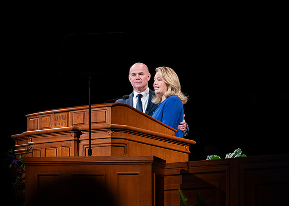President and Sister Meredith speaking in devotional.