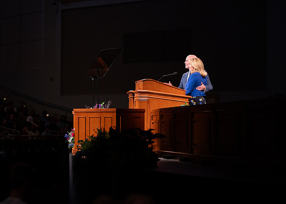 President and Sister Meredith speaking in devotional.