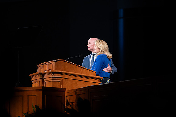 President and Sister Meredith speaking in devotional.
