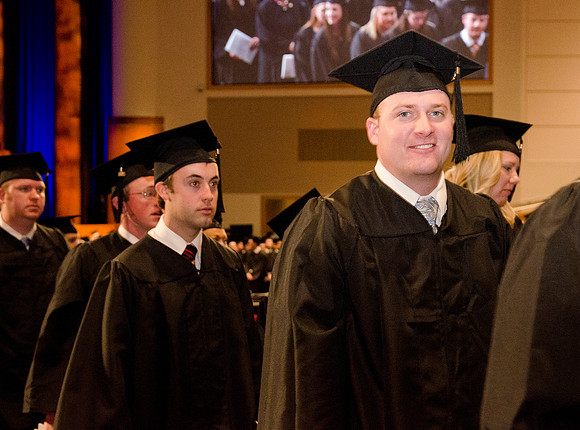 The Graduates make their way out of the I-Center after Commencement. Photo by Erik Hill.