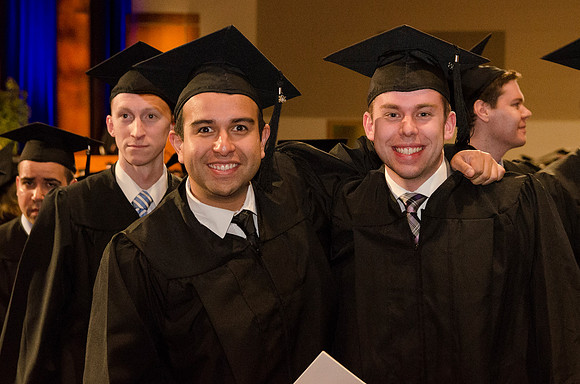 The Graduates make their way out of the I-Center after Commencement. Photo by Erik Hill.