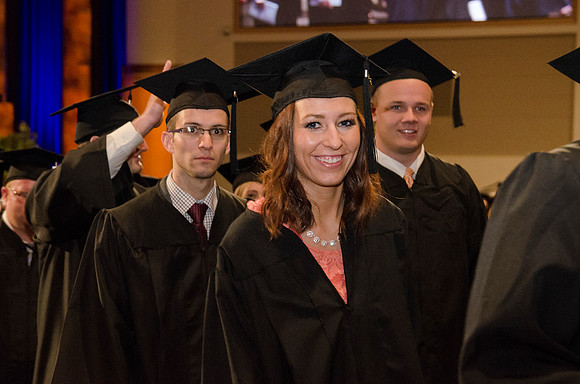 The Graduates make their way out of the I-Center after Commencement. Photo by Erik Hill.