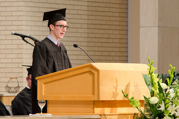 Graduate Forrest Hubert speaks during the Convocation Ceremony. Photo by Erik Hill.