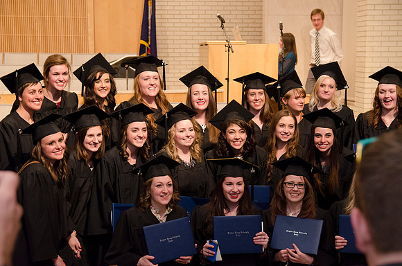 Graduates from the Collge of Physical Science Engineering pose for a photo after their Convocation Ceremony. Photo by Erik Hill.