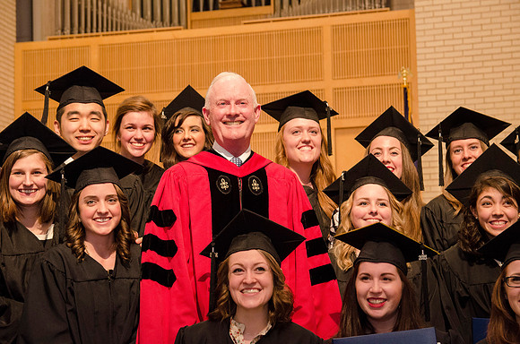 President Kim B. Clark poses with faculty and students during The College of Physical Science and Engineering Convocation. Photo by Erik Hill