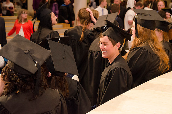 Graduates chat together after the Convocation Ceremony. Photo by Erik Hill.