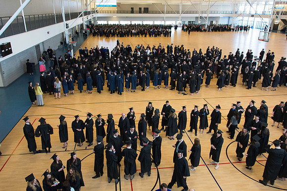 Graduates line up in the BYU-Idaho Center courts before the processional begins for Graduation at BYU-Idaho.