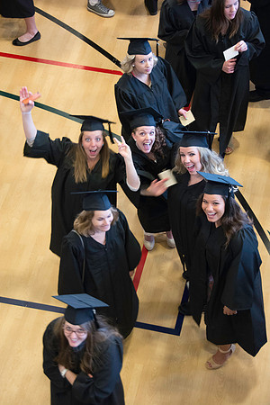 Graduates line up in the BYU-Idaho Center courts before the processional begins for Graduation at BYU-Idaho.
