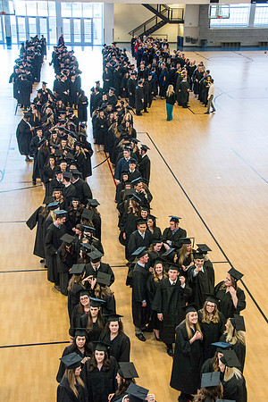 Graduates line up in the BYU-Idaho Center courts before the processional begins for Graduation at BYU-Idaho.