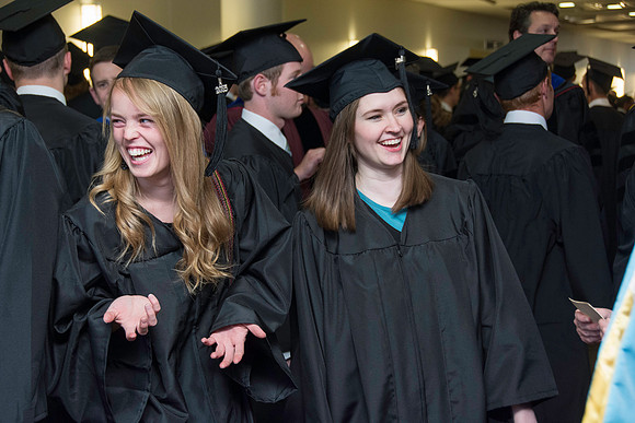 Graduates march in during the processional at the beginning of Graduation at BYU-Idaho.