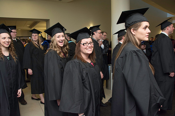 Graduates march in during the processional at the beginning of Graduation at BYU-Idaho.
