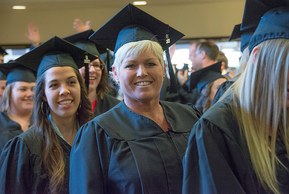 Graduates march in during the processional at the beginning of Graduation at BYU-Idaho.