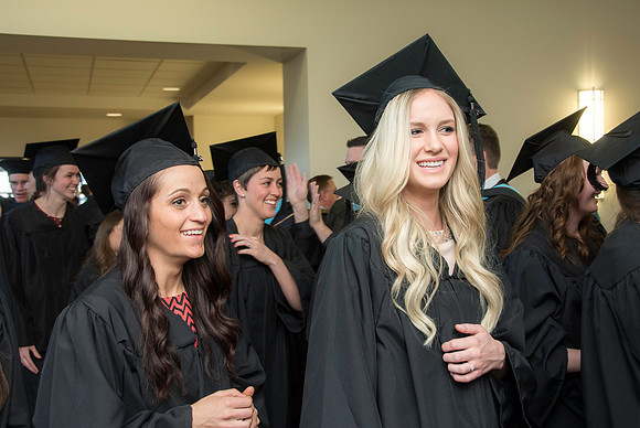 Graduates march in during the processional at the beginning of Graduation at BYU-Idaho.