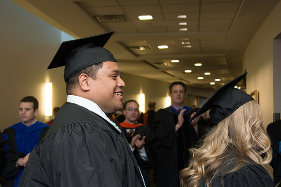 Graduates march in during the processional at the beginning of Graduation at BYU-Idaho.