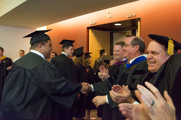Graduates march in during the processional at the beginning of Graduation at BYU-Idaho.