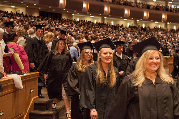 Student gather in the I-Center for the April Commencement Ceremony to listen to inspiring remarks from President Clark and Elder Robert C. Gay.