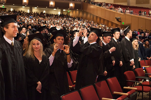 Student gather in the I-Center for the April Commencement Ceremony to listen to inspiring remarks from President Clark and Elder Robert C. Gay.