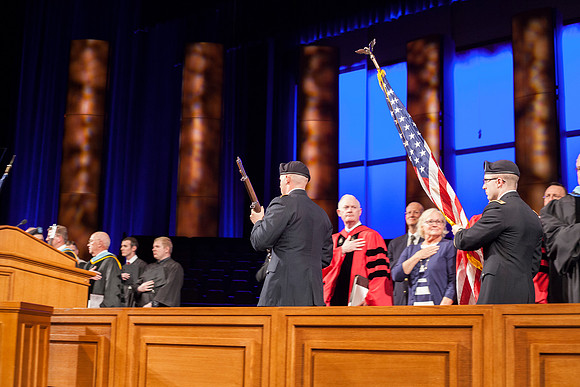 BYU-Idaho Army ROTC Cadet Flanigan and 2nd LT Bowler prepare to post the colors in the I-Center before the Commencement Ceremony begins.