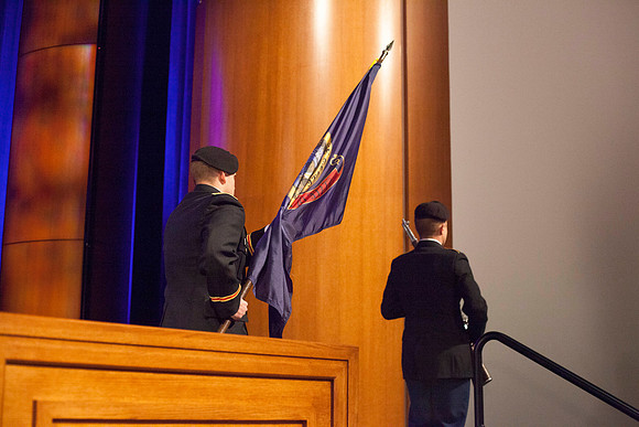 2nd LT Thielen and BYU-Idaho Army ROTC Cadet Evans prepare to post the state flag in the I-Center before the Commencement Ceremony begins.