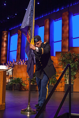 2nd LT Thielen from the BYU-Idaho Army ROTC posts the Idaho State Flag during the BYU-Idaho Commencement Ceremony.