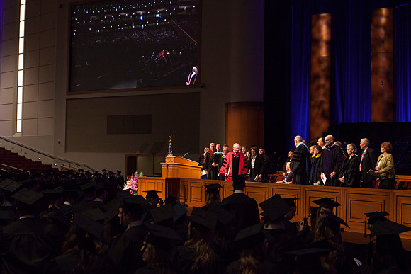 President Clark, Sister Clark, Elder Paul V. Johnson, and Elder Robert C. Gay from the First Quorum of the Seventy leave the Commencement Ceremony at BYU-Idaho. Photo by Tyler D. Rickenbach