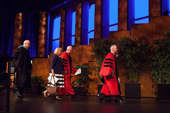 President Clark, Sister Clark, Elder Paul V. Johnson, and Elder Robert C. Gay from the First Quorum of the Seventy leave the Commencement Ceremony at BYU-Idaho. Photo by Tyler D. Rickenbach
