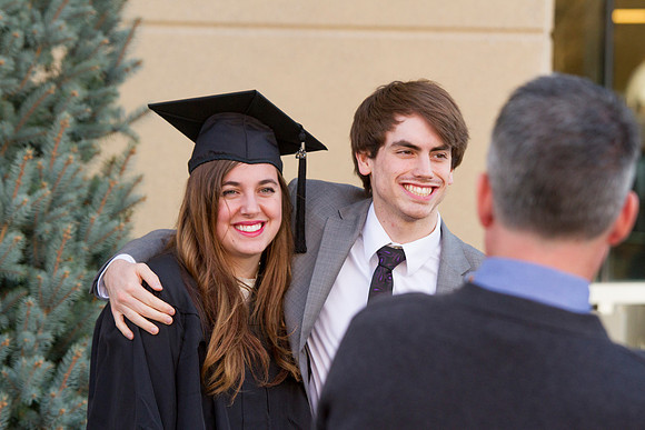 Kelsi Lynn Harris, an English Major, gets her picture taken outside the I-Center, just after the Commencement Ceremony.