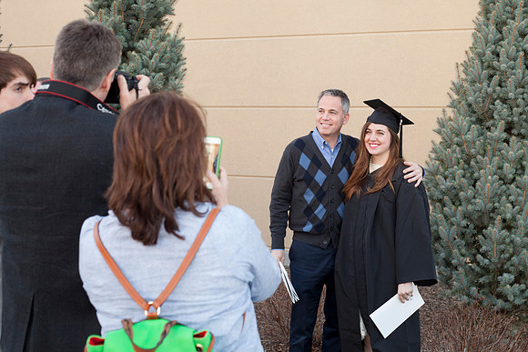 Kelsi Lynn Harris, an English Major, gets her picture taken outside the I-Center, just after the Commencement Ceremony.