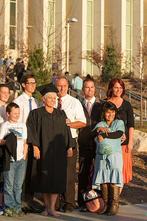 A graduate celebrates with her family after the April Commencement Ceremony.