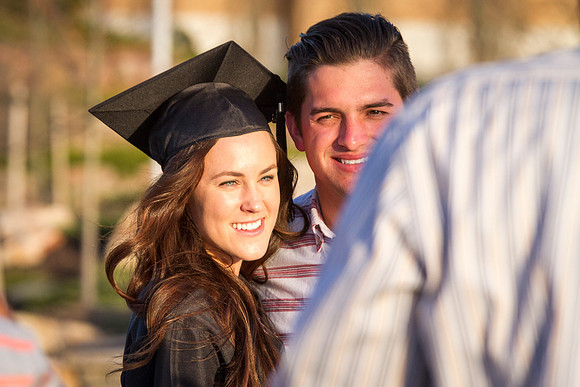 A graduate celebrates with her family after the April Commencement Ceremony.