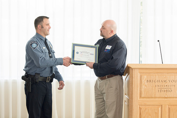 George Hames presenting the award to Bryan Lyons.