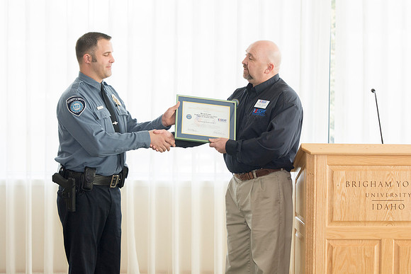George Hames presenting the award to Bryan Lyons.