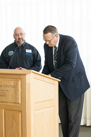 Garth Gunderson, University Security and Safety Director signs a contract from ESGR explaining his commitment to continue to help Students in the Guard and Reserves.