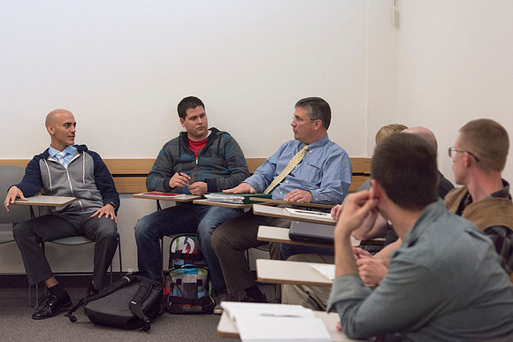 Students listen as Brother Robert's reviews student's projects during the 2014 Spring Semeter.