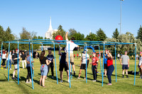Students gather at the upper field for various 4th of July activities.