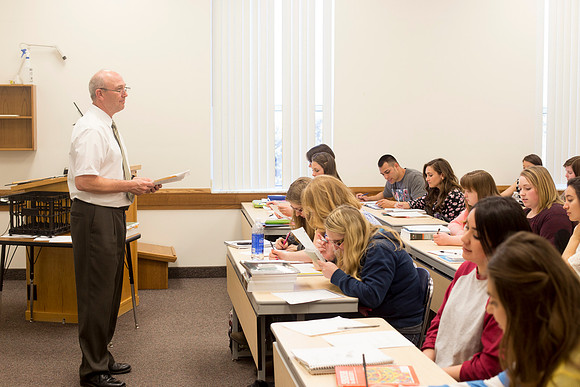 Brother Marion Johnstun Teaches his ED 334 class in the Hinckley Building.